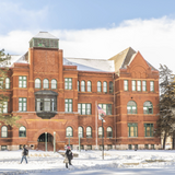 Snowy photo of Old Main.